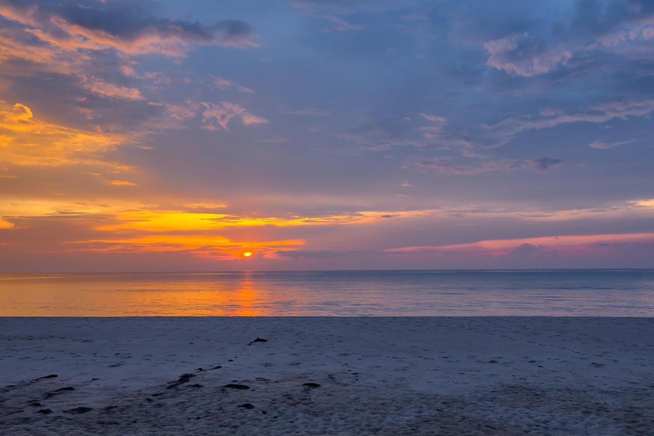 Outrigger Khao Lak Beach Resort - Sha Extra Plus Exterior photo Sunset over the Gulf of Riga