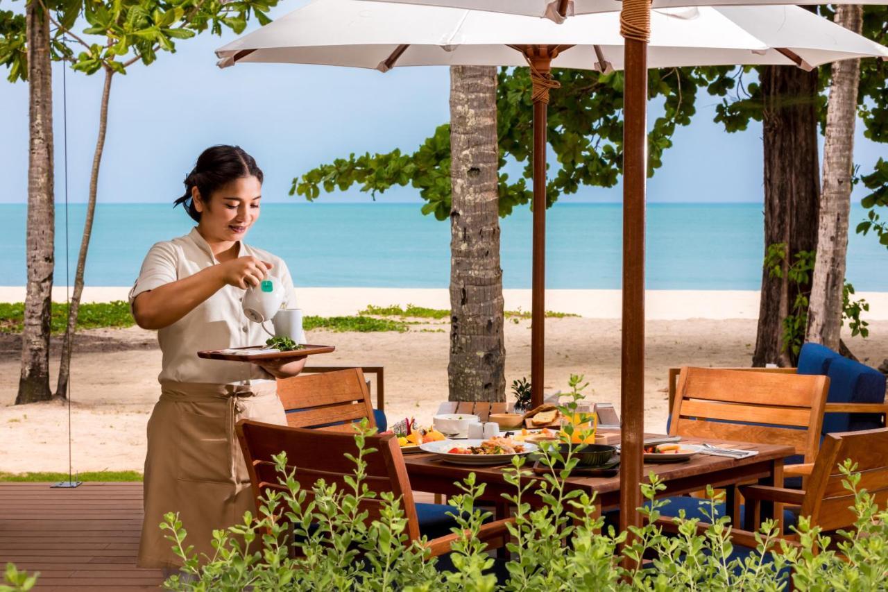 Outrigger Khao Lak Beach Resort - Sha Extra Plus Exterior photo A Thai waitress at a resort