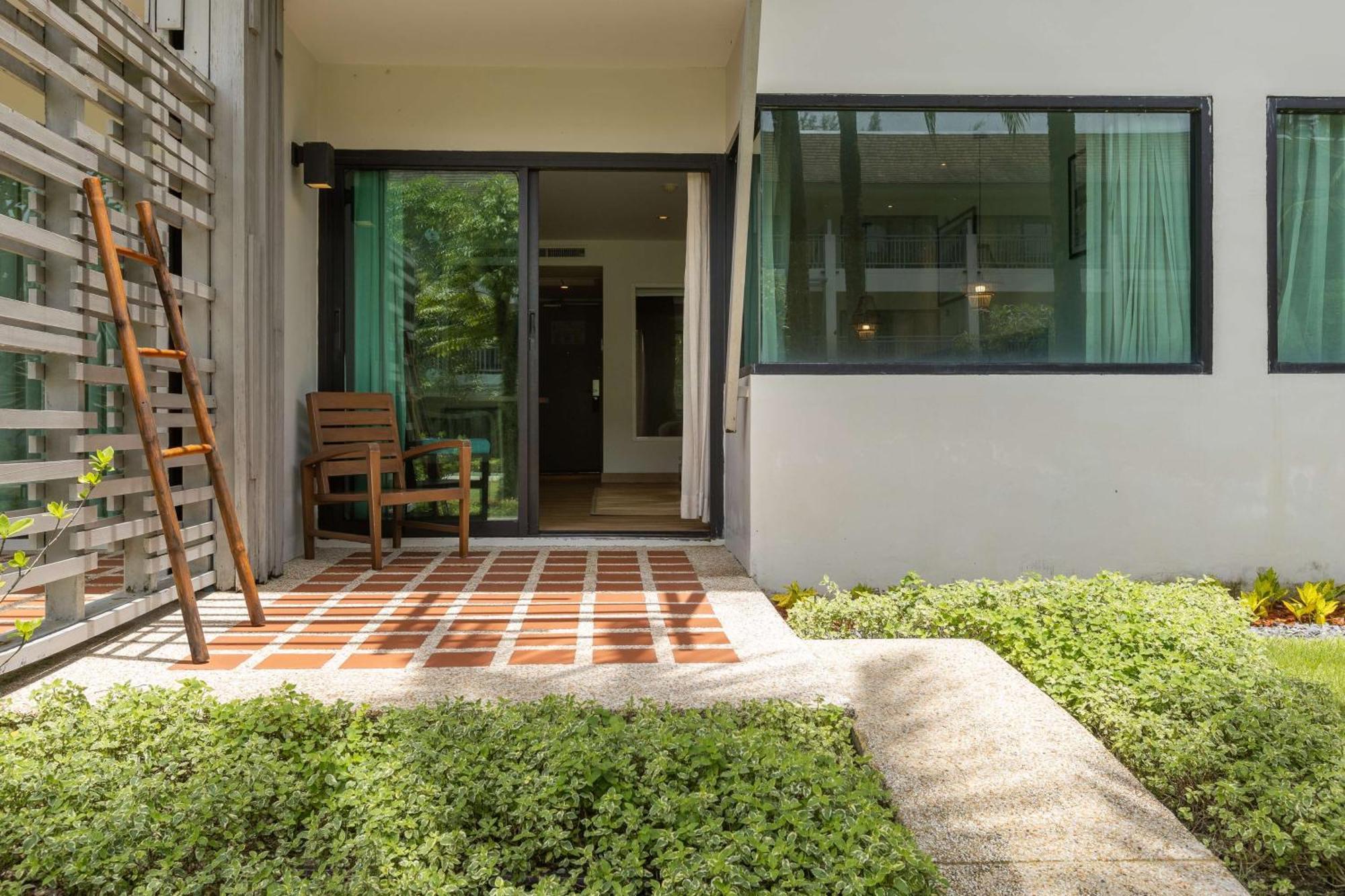 Outrigger Khao Lak Beach Resort - Sha Extra Plus Exterior photo A typical house in the village