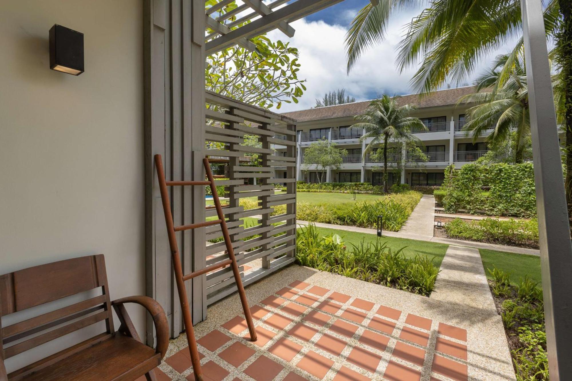 Outrigger Khao Lak Beach Resort - Sha Extra Plus Exterior photo A view of the hotel's grounds from a guest room